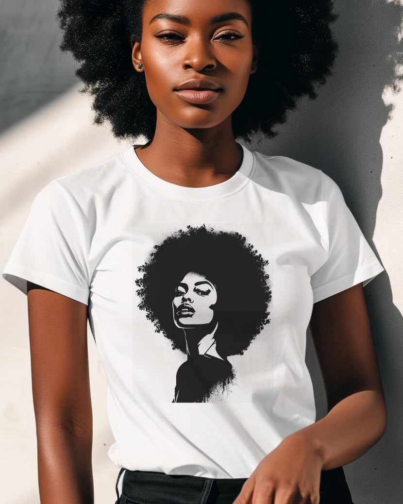 Woman wearing a white t-shirt with a black graphic of a woman with an afro against a neutral background